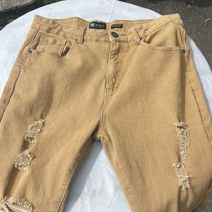 Tan jeans with rips